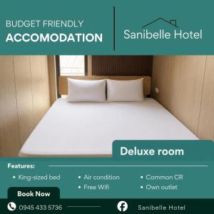 ein Bild von einem Bett in einem Zimmer in der Unterkunft Sanibelle Hotel in Coron