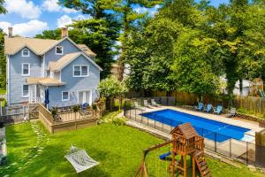a backyard with a pool and a house at Pool House Near NYC FIFA Stay for Groups in Roselle