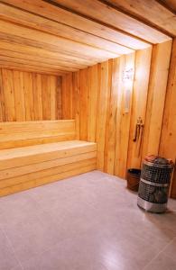 a wooden sauna with a bench in a room at Shahunts Resort in Odzun