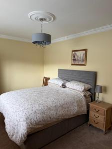 a bedroom with a bed and a blue light at Simple Stay Foxford in Foxford +9 photos
