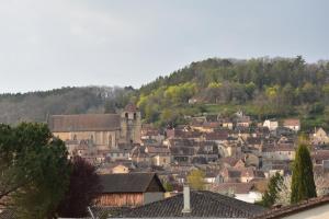 a view of a town with a mountain at Pause Périgord in Saint-Cyprien
