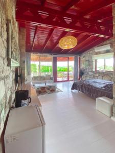 a bedroom with a bed and a living room at Casa del Olivia in Seferihisar +61 photos