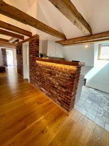 a brick wall in a living room with a brick wall at Belmonte in Sulzbach-Rosenberg +8 photos