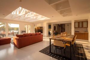 a living room with a couch and a table at Stay North - Merimaa in Tallbacka