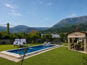 a backyard with a swimming pool and a gazebo at La Hacienda Percobic-Serenity & private pool in Bar