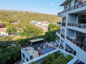 an aerial view of a building with a swimming pool at Stay at the Herold 605 in Herolds Bay