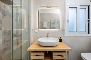 a bathroom with a white sink and a shower at Yi Garden Corfu in Corfu +52 photos