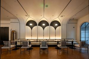 a restaurant with tables and chairs in a room at Neyar Luxury and Tranquil Aesthetics Hotel-Prime Location,8-min Walk to Chunxi Road & Sino-Ocean Taikoo Li in Chengdu