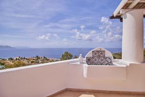 a balcony with a view of the ocean at Casa Alloro - Rinella in Leni