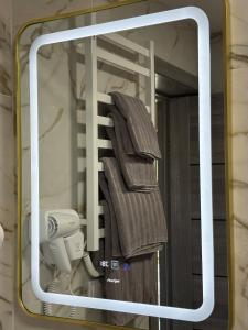 a towel on a towel rack in a bathroom at Evergreen cottage in Slavske +38 photos