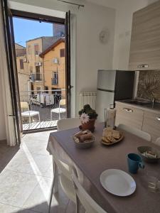 a kitchen with a table with food on it at B&B Sant'Anna in Lercara Friddi +26 photos