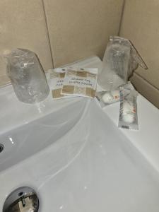 a white sink with plastic bags on top of it at B&B Sant'Anna in Lercara Friddi