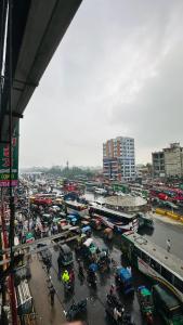 a city with a lot of traffic on a busy street at Hotel Paradise Residential in Dhaka