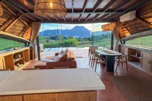 a living room with a couch and chairs and a table at Viento Blanco in Independencia