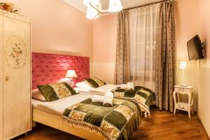 Posteľ alebo postele v izbe v ubytovaní Aparthotel Oberża