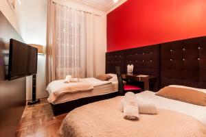 Posteľ alebo postele v izbe v ubytovaní Aparthotel Oberża