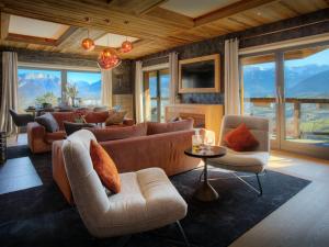 a living room with a couch and chairs at Chalet Kalyssia - OVO Network in Saint-Jorioz