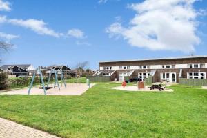 a park with a playground in front of a building at C11699-Hemmet-Vester-Faelled-70-A5 in Hemmet