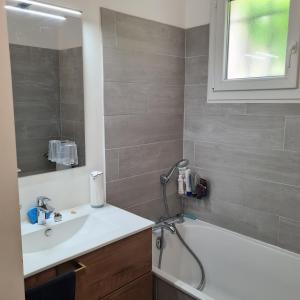a bathroom with a sink and a bath tub at Sunny house in Pierrefeu-du-Var +33 photos