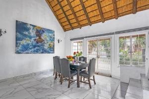 a dining room with a table and chairs at Mandy place in Sandown