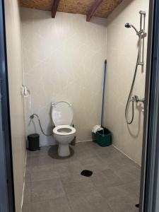 a bathroom with a toilet and a shower at karavana.ta in Chernomorets +9 photos