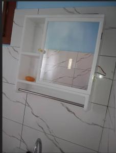 a window in a bathroom with a marble counter top at FARAFINA KEUR DAMEL Toubakouta in Toubakouta