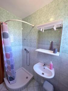a bathroom with a shower and a sink at Apartmani Maria in Preko +33 photos