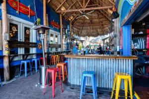 a bar with colorful stools in a restaurant at Villa Vista Mare - 675 in Siesta Key