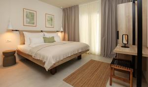 a bedroom with a bed and a large window at Casa Serena Bol in Bol
