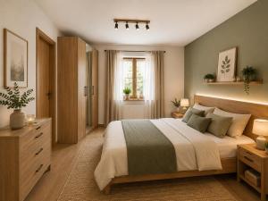 a bedroom with a large bed and a window at Haus Dippel am Kurpark inklusive Chiemgaukarte in Ruhpolding