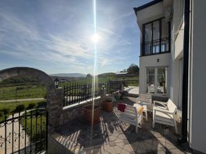 a balcony of a house with a view of the countryside at Villa Berisha in Mazgit