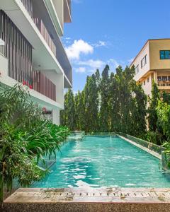 a swimming pool in the middle of a building at Solaris Luxury Residence Osu Pool Gym in Accra
