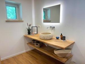 a bathroom with a sink and a mirror at Villa Bergsmåla in Eringsboda +60 photos