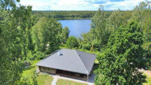 an aerial view of a house with a lake at Villa Bergsmåla in Eringsboda
