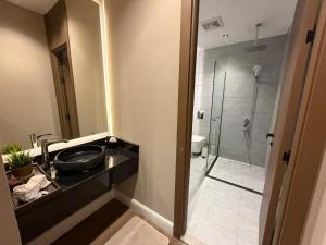 a bathroom with a sink and a shower at Atrah Quiet Stylish Studio in Medina