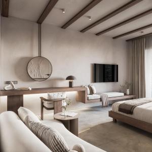 a bedroom with two beds and a living room at Geomilos Private Suites Milos in Triovasálos