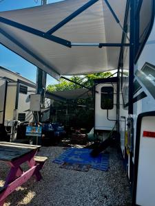 a white tent with a blue mat under it at EL Camper KW in Key West