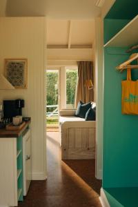 a room with a bed and a window in a room at Barlume Beach in Montauk