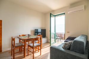 a living room with a table and a couch at Casa Dreamo in Sarnico