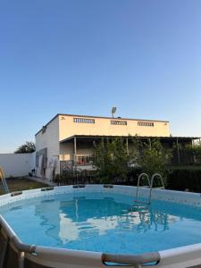 a large swimming pool in front of a building at Safae in Agadir