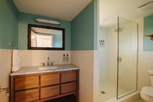 a bathroom with a sink and a shower at Barlume Beach in Montauk +25 photos
