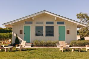 a house with chairs in front of it at Barlume Beach in Montauk