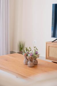 a small arrangement of flowers on a table at EARTH VILLA Poros in Poros