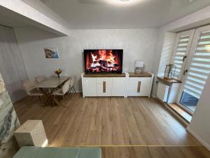 a living room with a fireplace in the wall at Anuszka Apartament 3 in Gdynia +10 photos