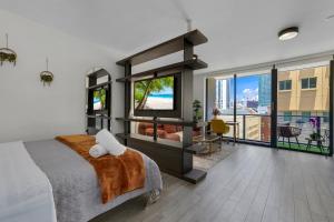a bedroom with a bed and a view of the city at Miami Downtown Bayside Balcony Studio in Miami +29 photos