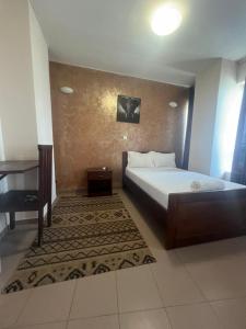 a bedroom with a bed and a piano at Maison Babacar TOURE in Dakar