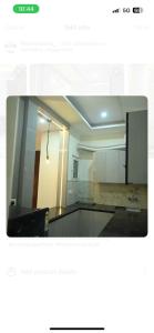 a view of a room with a large mirror at Thecrestoria in Dehradun +3 photos