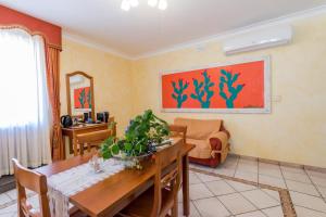 a living room with a table and a couch at Residence Alberghiero Eolie in Lipari