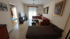 a living room with a couch and a table at Dream Home in Sparta