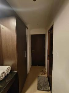 a room with a bed and a pair of scissors at Continento the classic hotel in Malappuram